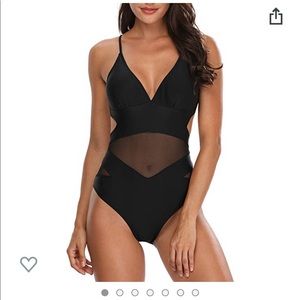 Sexy black one piece. Bow on the back.